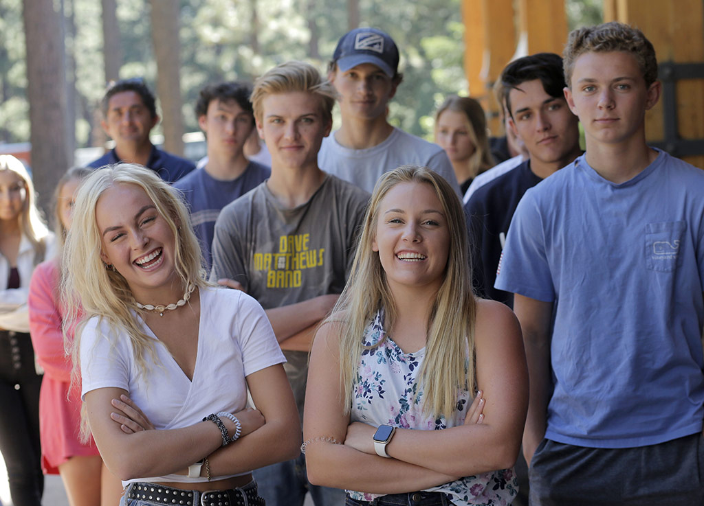 a group of students standing closely together posing for a group photograph